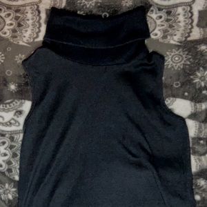 Black sleeveless turtle neck